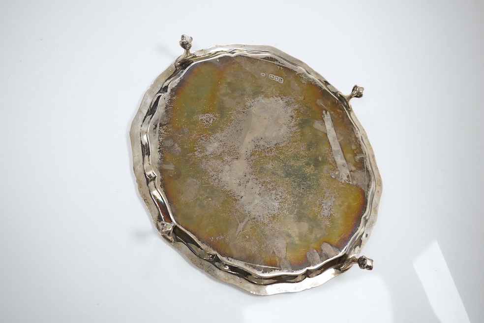 An Edwardian silver salver by Thomas Bradbury & Sons, London, 1903, on four claw and ball feet, 17.9oz. Condition - fair